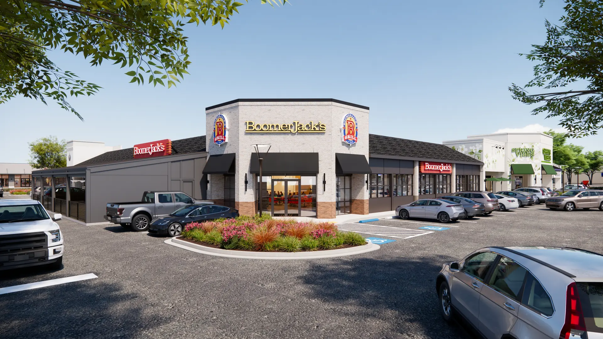 BoomerJack's restaurant exterior with parking lot, cars, and landscaped entrance on sunny day